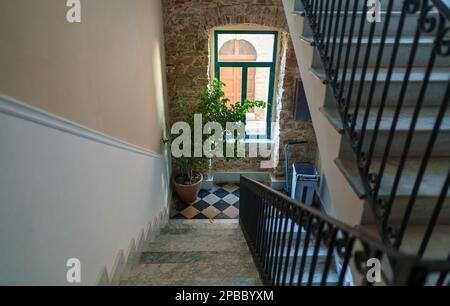 Staircase in the interior with marble floor. Porch inside the building. Stock Photo