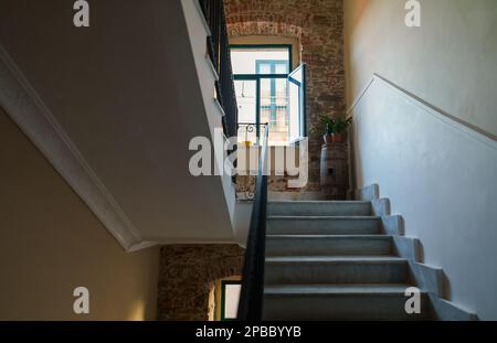 Staircase in the interior with marble floor. Porch inside the building. Stock Photo