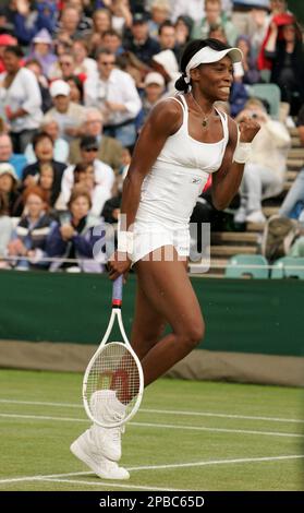 Venus Williams reacts as she defeats Japan's Akiko Morigami in their Women's Singles match at Wimbledon, Monday July 2, 2007.(AP Photo/Kirsty Wigglesworth) ** EDITORIAL USE ONLY **
