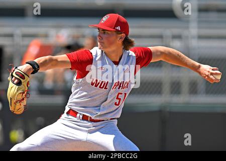 CORAL GABLES, FL - MAR 12: NC State infielder Matt Heavner (32) throws  prior to the game as the Miami Hurricanes faced the NC State Wolfpack on  March 12, 2023, at Mark