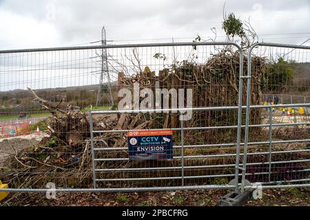 Wendover, Buckinghamshire, UK. 12th March, 2023. The remains of a garden fence at a house demolished by HS2. It has been announced that the Birmingham to Crewe phase of HS2 has been put on hold due to escalating costs. HS2 costs are expected to rise to over 100 billion pounds.  Credit: Maureen McLean/Alamy Live News Stock Photo