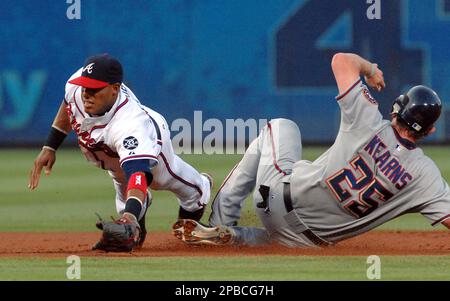 Philadelphia Phillies second baseman Chase Utley, left, puts out Washington  Nationals Nook Logan, caught trying to steal second base in the third  inning of a baseball game in Philadelphia on Thursday, July