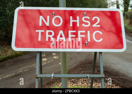 Wendover Dean, Buckinghamshire, UK. 12th March, 2023. A No HS2 traffic sign in the Chilterns. The High Speed Rail 2 Phase 1 construction work is carrying on, however, it has been announced this week that the Birmingham to Crewe phase of the HS2 has been put on hold due to escalating costs. The current costs of the project are hugely over budget and are expected to exceed 100 billion pounds. HS2 is having a hugely detrimental impact upon residents living along the line some of whom have had their houses demolished and farmers have had their land taken by HS2 but are allegedly yet to receive any Stock Photo