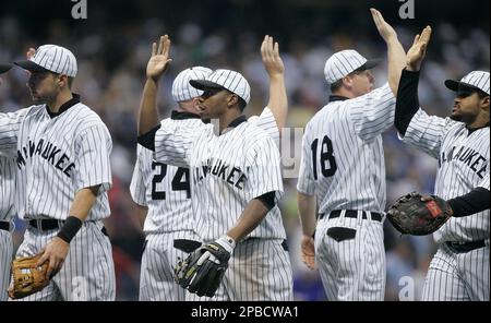 Milwaukee Brewers' Ryan Braun (8), Gabe Kapler (33) and Mike Cameron,  center, celebrate after the ninth inning of a baseball game against the  Pittsburgh Pirates on Sunday, July 6, 2008, in Milwaukee.