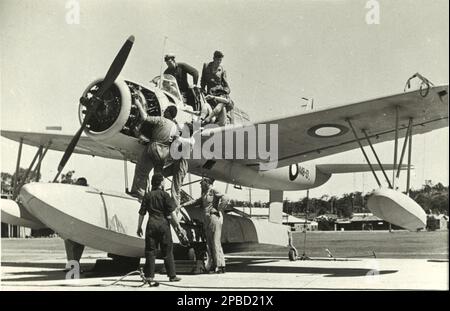 Engineers check out The Polar Star, a single-engine Vought-Sikorsky Kingfisher floatplane bound for Antarctica on board the HMAS Wyatt Earp in 1947-48. Stock Photo