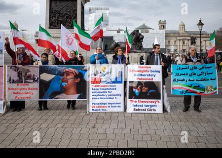Iranians hold Iranian flags and placards during a rally demanding to Iranians hold Iranian flags and placards during a rally demanding to