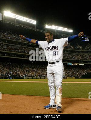 The Texas Rangers' Sammy Sosa gestures during a ceremony to honor him in  for his 600th home run prior to the game against the Cleveland Indians at  Rangers Ballpark in Arlington, Texas