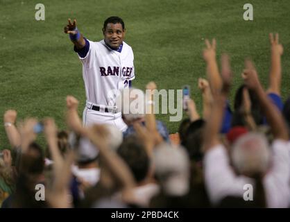 The Texas Rangers' Sammy Sosa gestures during a ceremony to honor him in  for his 600th home run prior to the game against the Cleveland Indians at  Rangers Ballpark in Arlington, Texas