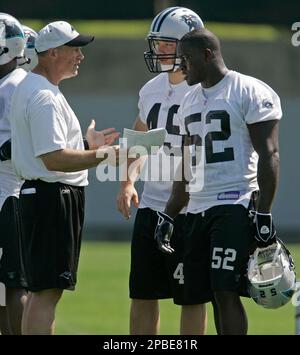 Carolina Panthers linebackers coach Ken Flajole gives instructions to  rookie Jon Beason during Beason's first practice at training camp in  Spartanburg, South Carolina, Monday, August 6, 2007. (Photo by David T.  Foster