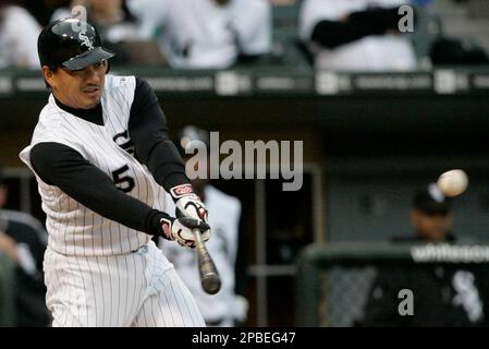 Chicago White Sox's Tadahito Iguchi, of Japan, flips his glove into the air  after he was doubled up on first base on a Jermaine Dye infield line drive  against the Los Angeles
