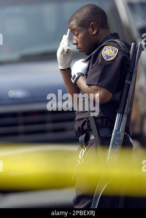 https://l450v.alamy.com/450v/2pbexrj/a-maryland-department-of-corrections-officer-wipes-sweat-from-his-brow-while-standing-guard-outside-the-metropolitan-transition-center-hospital-after-as-many-as-15-people-were-stabbed-some-of-them-seriously-when-a-fight-broke-out-among-inmates-friday-june-1-2007-at-the-metropolitan-transition-center-correctional-facility-in-baltimore-ap-photosteve-ruark-2pbexrj.jpg