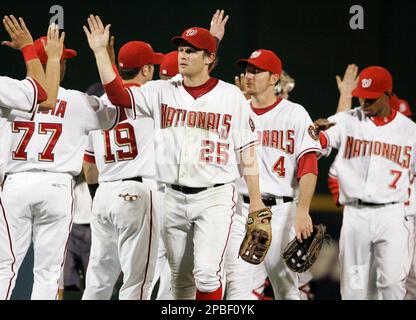 Philadelphia Phillies second baseman Chase Utley, left, puts out Washington  Nationals Nook Logan, caught trying to steal second base in the third  inning of a baseball game in Philadelphia on Thursday, July