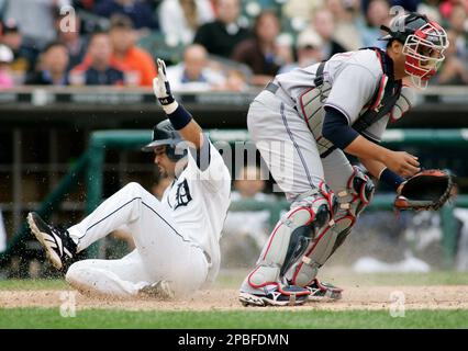 Detroit Tigers' Placido Polanco, right, is congratulated by Miguel Cabrera  after scoring in the third inning of a baseball game against the Kansas  City Royals, Saturday, Aug. 30, 2008, in Detroit. (AP