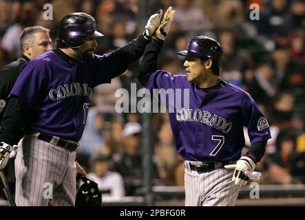 Colorado Rockies' Kazuo Matsui, right, gets a thumbs up from