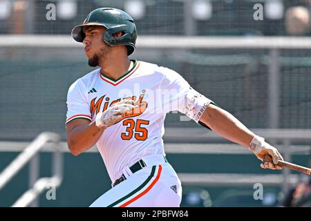 CORAL GABLES, FL - MAR 12: NC State infielder Matt Heavner (32) throws  prior to the game as the Miami Hurricanes faced the NC State Wolfpack on  March 12, 2023, at Mark