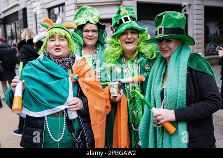 London, UK. 12th Mar, 2023. Spectators of the St Patrick's Day Parade. London's Irish community celebrated St Patrick's Day Festival with a parade in Central London, with performance by marching bands, sports clubs and Irish dancing schools. More than 50,000 people were expected to participate in the party and to admire Irish dancing, food and music. Credit: SOPA Images Limited/Alamy Live News Stock Photo