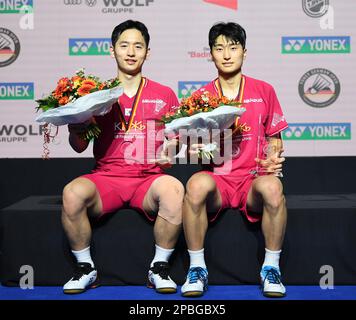 Muelheim, Germany. 12th Mar, 2023. Chio Sol Gyu/Kim Won Ho (R) of South Korea pose after the medal ceremony of men's doubles at the Yonex German Open 2023 badminton tournament in Muelheim, Germany, March 12, 2023. Credit: Ren Pengfei/Xinhua/Alamy Live News Stock Photo