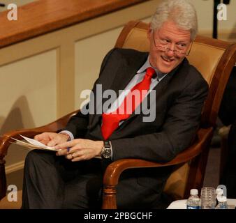 Former President Bill Clinton reacts as he enjoys the musical program preformed by the Richland Northeast GAP Choir at the NAACP National Freedom Fund awards and fundraiser Friday, May 18, 2007, at Bible Way Church of Atlas Road in Columbia, S.C. (AP Photo/Mary Ann Chastain)