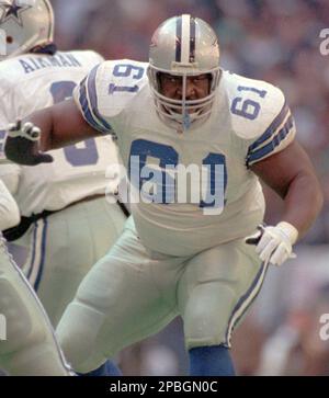 ADVANCE FOR WEEKEND FEB. 22-23- Former Dallas Cowboys' Mark Stepnoski looks  out a window at his home in Plano, Texas, on Jan. 9, 2003. The former  offensive lineman considers himself living proof