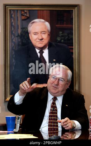 **FILE** Rev. Jerry Falwell gestures in front of a portrait of himself during a interview at Liberty University in Lynchburg, Va., in a June 20, 2006 file photo. A Liberty University executive says the Rev. Jerry Falwell has died. (AP Photo/Steve Helber, File)