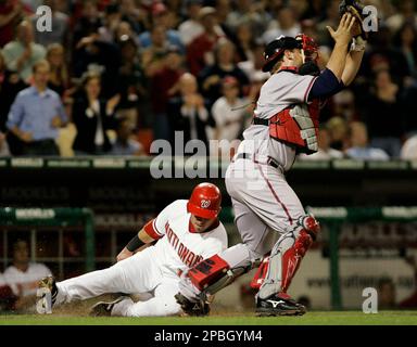 Washington, D.C. - April 3, 2005 -- Washington Nationals Ryan Church,  right, is congratulated by teammates Brad Wilkerson, center, and Vinny  Castilla, left, after hitting a three-run home run in the second