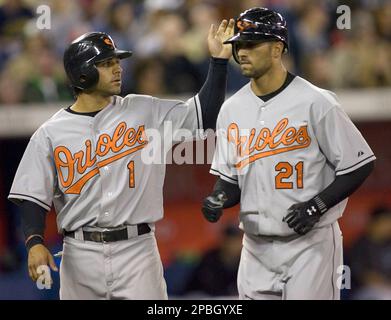 Baltimore Orioles' Brian Roberts congratulates Melvin Mora after Mora hit a  two-run homer, scoring Roberts, off Houston Astros pitcher Wandy Rodriguez  in the first inning Wednesday, June 15, 2005, in Baltimore.(AP Photo/Gail