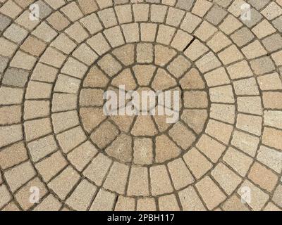 Circular paver bricks in sunlight Stock Photo