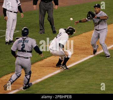 New York Yankees Doug Mientkiewicz rounds third base past Mike Lowell after  hitting a 3 run homer against the Boston Red Sox in the third inning at  Yankees Stadium in New York