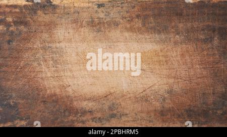 wooden chopping board background, old distressed scratched brown color surface for photography backdrop with natural vignette, copy space Stock Photo