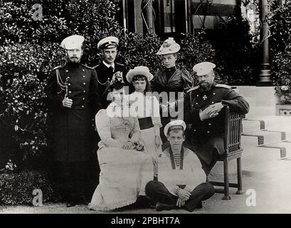 1891 ca  : The family of Czar Aleksandr III ( 1845-1894 ). Right in the image of the Tsar, his wife left front Czarine Maria Fedorovna Dagmar of Denmark (1847-1928) , left the eldest son, Nikolai , later Czar Nicholas II . In this photo the others sons: George Alexandrovich (1871-1899), Xenia Alexandrovna (1875-1960, later married with Grand Duke Alexander Mikhailovich ), Michael Alexandrovich (1878-1918, later married with Natalia Brassova ) and Olga Alexandrovna (1882-1960 , later married with Duke Peter Alexandrovich of Oldenburg and after with Colonel Nikolai Alexandrovich Kulikovsky ). Th Stock Photo