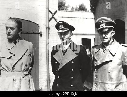 1945 , 23 may , GERMANY  : The german SS architect and Minister of Armaments ALBERT SPEER ( 1905 - 1981 ), the Grand Asmiralnaval Commander  KARL DOENITZ ( 1891 - 1980 , nomined Fuhrer of 3nd Reich after the death of Adolf Hitler , for 20 days ) and the Chief of the Operations Staff of the Armed Forces High Command Colonel General ALFRED JODL ( 1890 - 1946 ), photographed at General Quarter of BRITISH army after the capture . Jodl signed the instruments of unconditional surrender on May 7, 1945 in Reims as the representative of Karl Donitz . Only Alfred Jodl at Nuremberg judgement  was tried, Stock Photo