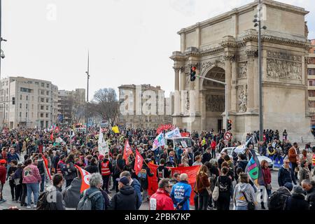 Protesters from the CGT (General Confederation of Workers) union march with flags during the demonstration. French unions have called for a seventh day of action against the French government's pension reform that would raise the retirement age from 62 to 64. The police estimate, for this 7th day, the number of demonstrators marching in the streets of Marseilles at 7,000 while the unions estimate it at 80,000. The Ministry of the Interior reports 368,000 demonstrators in the streets of France, while the unions claim more than 1 million Stock Photo