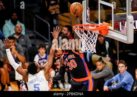 Los Angeles, United States. 12th Mar, 2023. New York Knicks forward Julius Randle (R) goes up for a dunks under pressure from Los Angeles Lakers guard Malik Beasley (L) during an NBA basketball game at Crypto.com Arena. New York Knicks beat Los Angeles Lakers 112-108 Credit: SOPA Images Limited/Alamy Live News Stock Photo