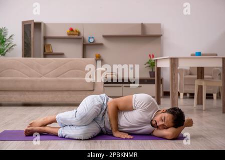 Young man doing sport exercises in the morning Stock Photo