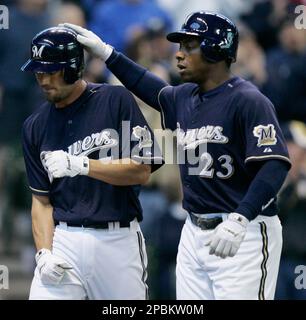 Milwaukee Brewers' J.J. Hardy (7) congratulates Jason Kendall (18) during  the eighth inning of a baseball game against the Minnesota Twins on  Wednesday, June 24, 2009, in Milwaukee. Hardy scored on a