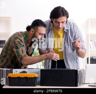 The it engineers working on hardware issue Stock Photo