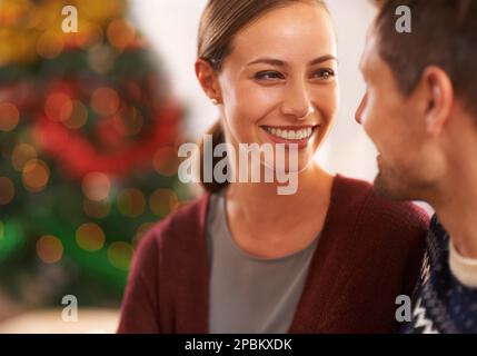 Christmas is always a happy time of year for this couple. a happy young couple on Christmas day. Stock Photo
