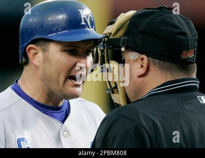 Kansas City Royals first baseman Mike Sweeney holds a Bible as he and his  wife Shara pray during a morning gathering Sunday, March 28, 2004, on the  outfield spectator grass at Surprise