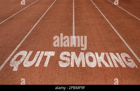 Quit Smoking written on running track, New Concept on running track text in white colour Stock Photo