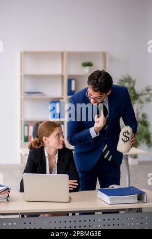 Boss and young secretary in remuneration concept Stock Photo - Alamy