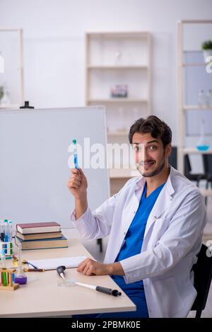 Young chemist working at the lab Stock Photo