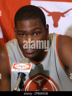 Texas basketball player Kevin Durant, left, walks with his mother, Wanda  Pratt, center and Texas coach