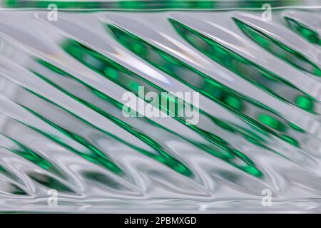 Defocused abstract macro texture background view of a beautiful modern lead crystal glass surface with shimmering diagonal lines Stock Photo