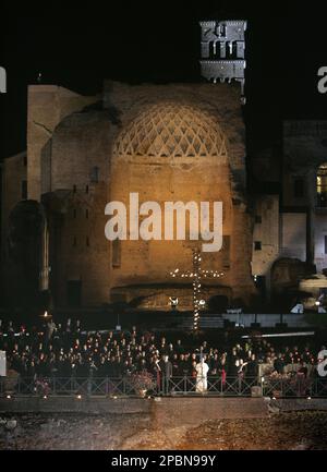 Pope Benedict XVI Holds A Wooden Cross Before The Faithful During The ...