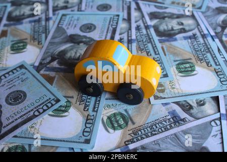 Selective focus image of car and money. Transportation and automobile industry concept Stock Photo