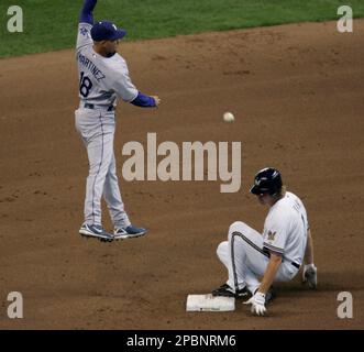 Milwaukee Brewers J.J. Hardy gets a fist with thumbs up from first base  coach Eddie Sedar after hitting a two run RBI single off of St. Louis  Cardinals pitcher Todd Wellemeyer in