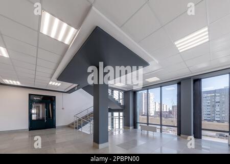 empty modern hall room with columns, doors and panoramic windows. Stock Photo