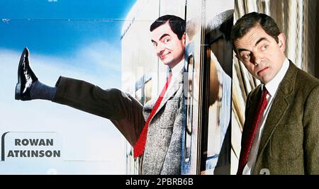 Image of Comic Rowan Atkinson poses as his character Mr Bean to