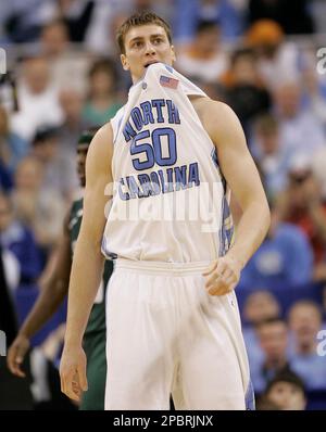 North Carolina's Tyler Hansbrough reacts after a slam dunk during