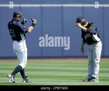 Colorado Rockies' Kazuo Matsui, right, gets a thumbs up from